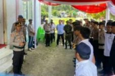 Kasi Humas Polres Boltim, Ipda Reynold Wowor, dalam apel konsolidasi yang digelar di Balai Pertemuan Umum (BPU) Desa Tutuyan, Kecamatan Tutuyan, pada Kamis (29/8/2024) malam